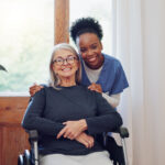 Senior care, nurse and old woman with wheelchair, portrait and smile in health at nursing home. Support, kindness and happy face of caregiver with elderly person with disability for homecare service. Finding the Best Home Care Agencies in Northeast Philadelphia