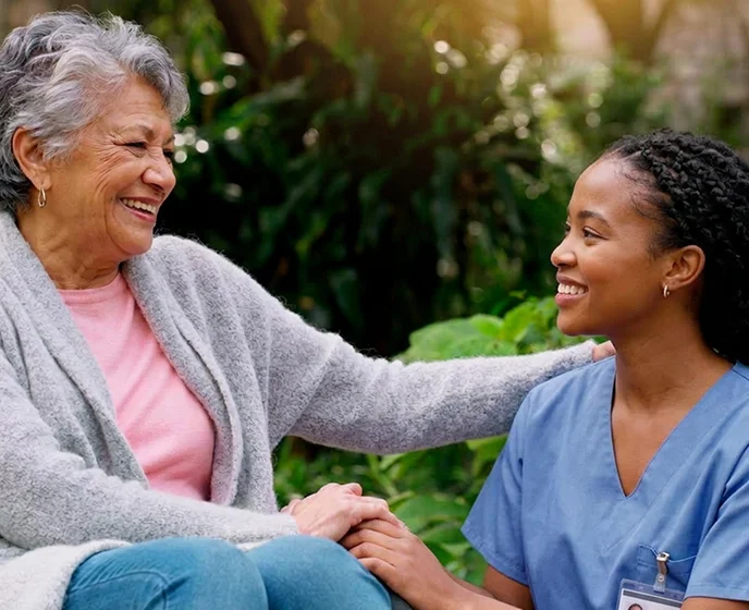 Compassionate caregiver providing emotional support and companionship to senior woman at home