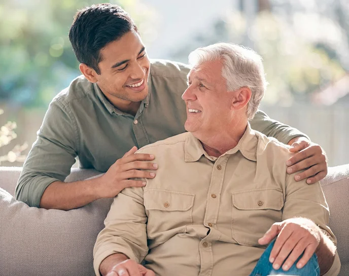 Caring companion supporting happy senior man with friendly in-home assistance