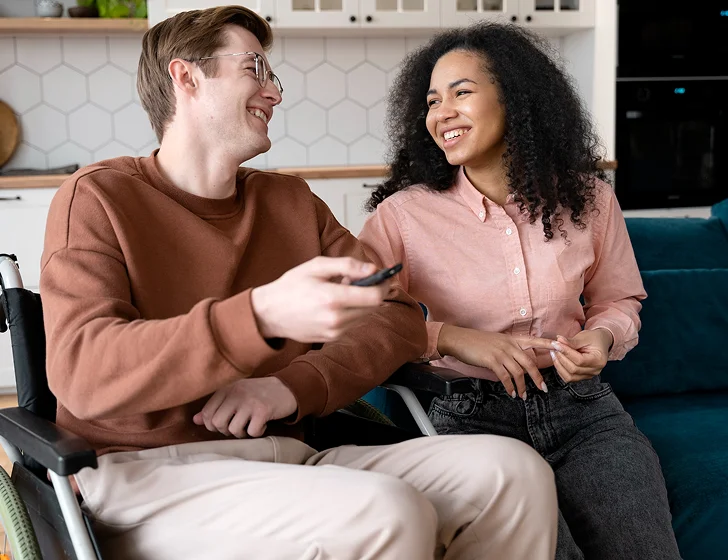 Young couple enjoying companionship and inclusive independent living support at home