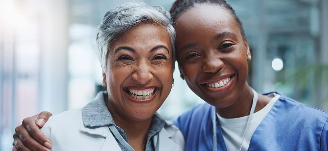 Smiling caregiver and senior woman enjoying compassionate elderly care and companionship