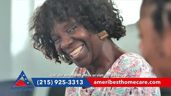 Happy senior woman smiling during in-home caregiver support and companionship services