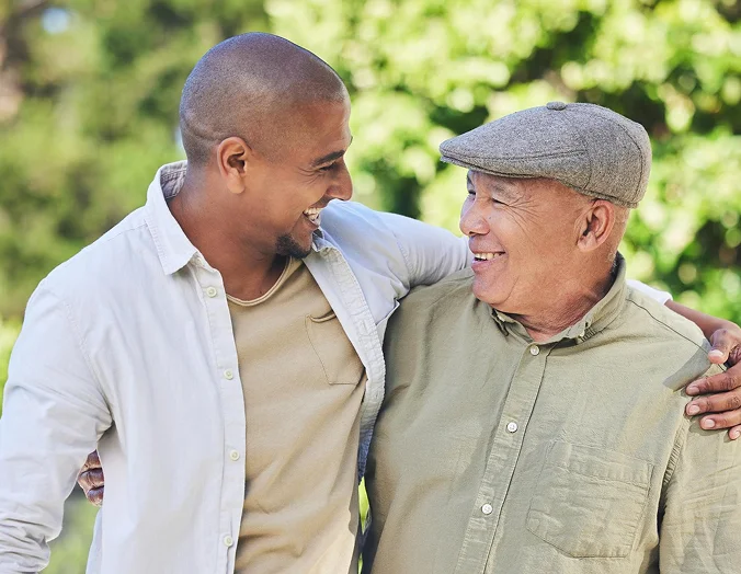 Caregiver and senior man enjoying time together outdoors